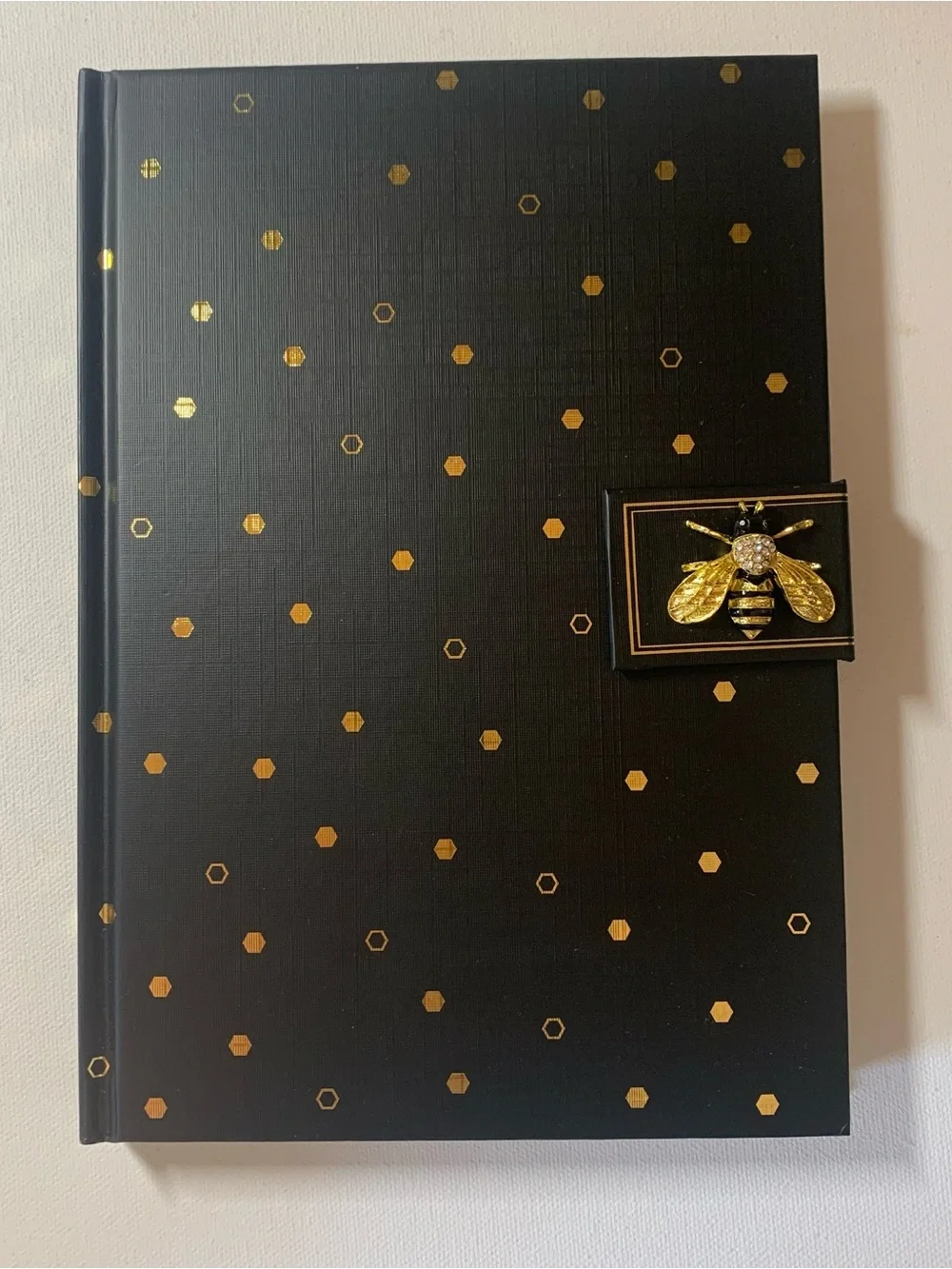 Brand new Punch Studio Black notebook with gold polka dots and gold bee charm